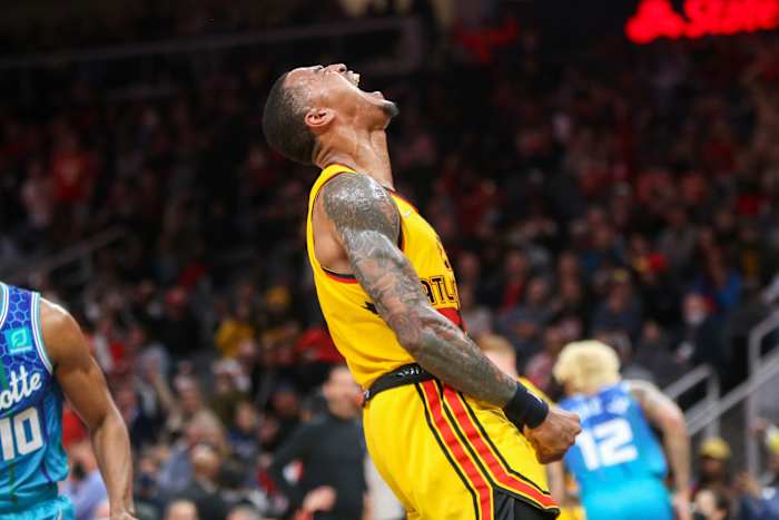 Hawks forward John Collins celebrates after a dunk.